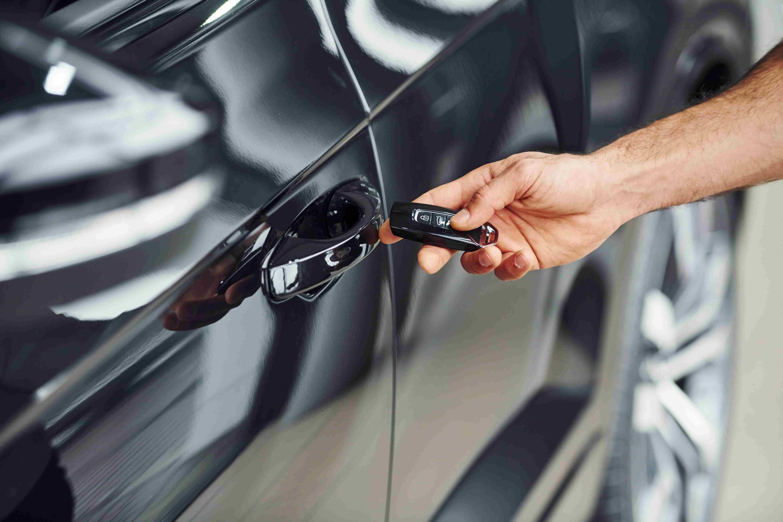 close-up-view-of-man-s-hand-that-holds-automobile-2026-03-24-06-26-20-utc (2)_11zon